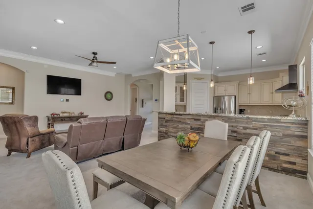 a living room with furniture fireplace and a flat screen tv