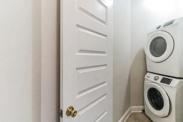 a bedroom with a bed and large window