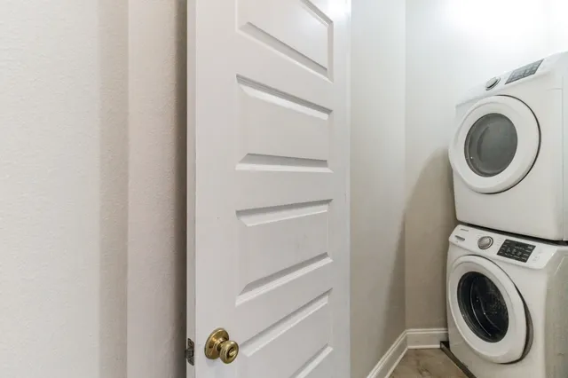 a bedroom with a bed and large window