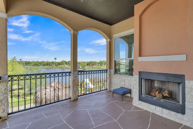 a bedroom with a bed and large window