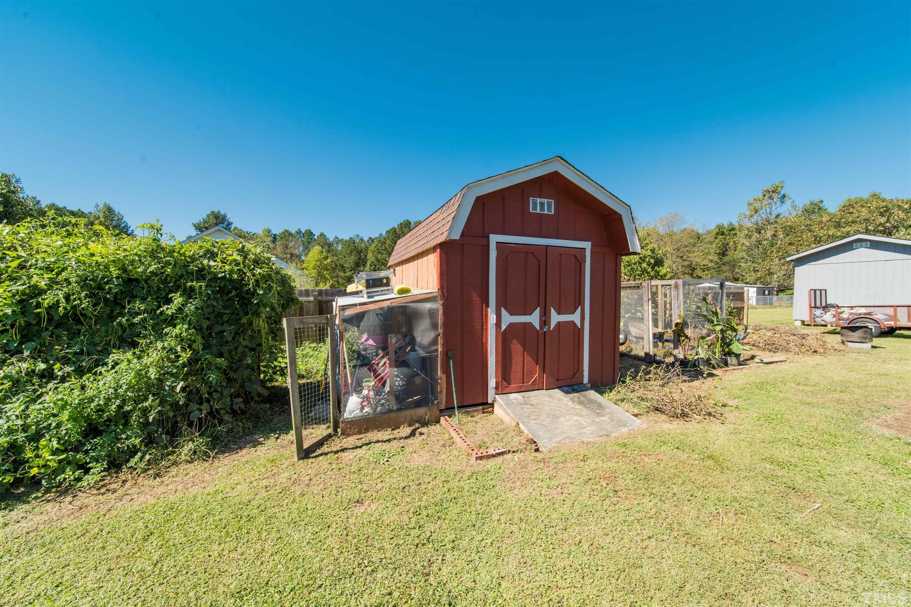 1283 Lee Road Clayton, NC 27520 - Photo 28 of 32 a view of a house with a yard