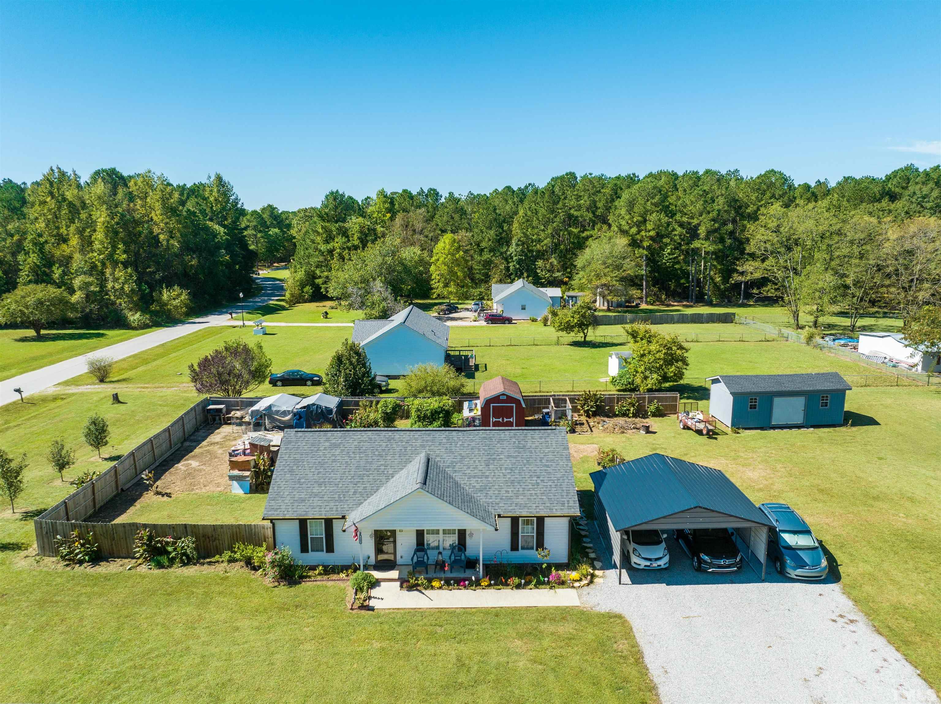 1283 Lee Road Clayton, NC 27520 - Photo 5 of 32 a view of a swimming pool and lake view