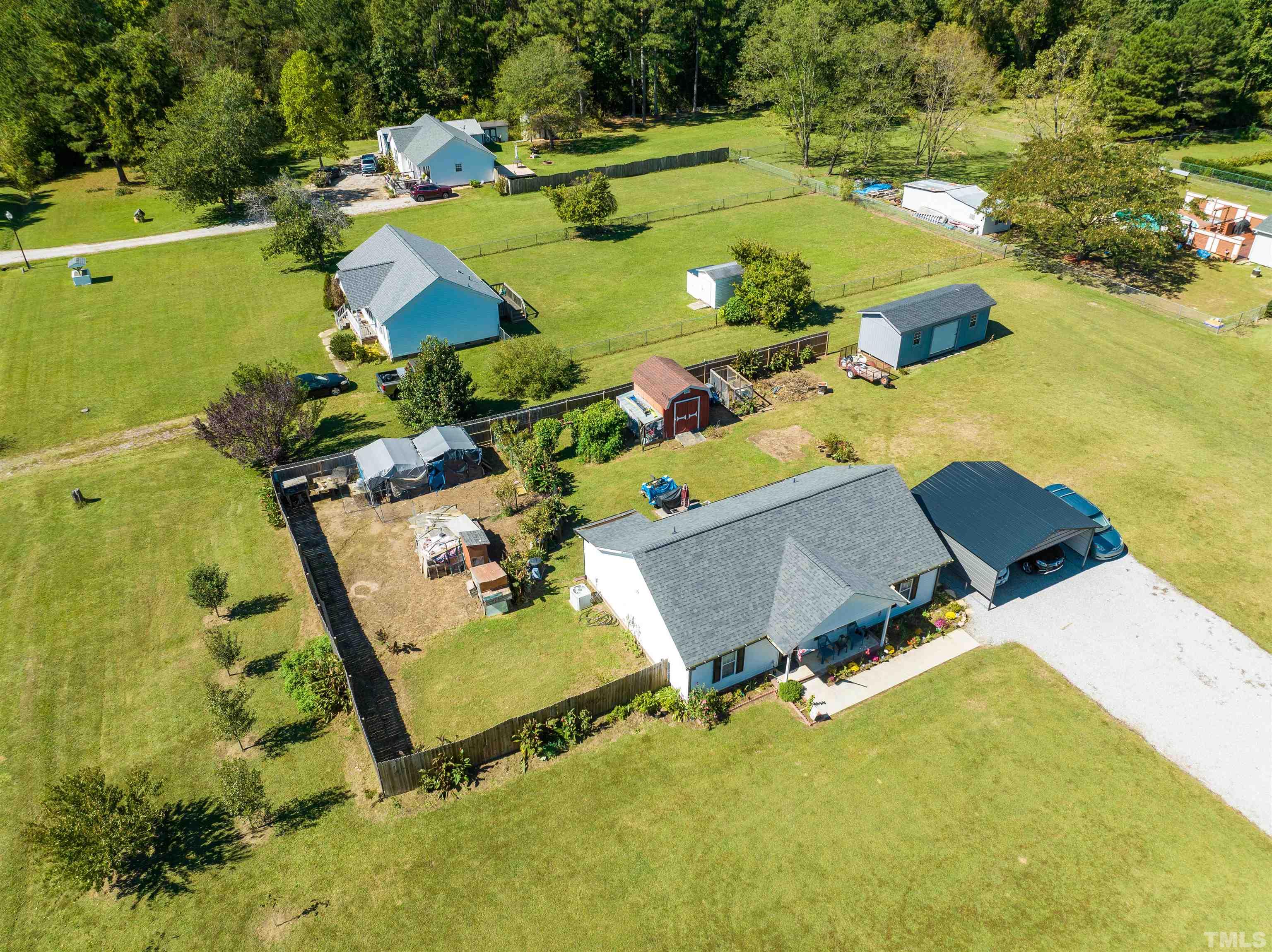 1283 Lee Road Clayton, NC 27520 - Photo 6 of 32 an aerial view of a pool yard swimming pool and outdoor seating