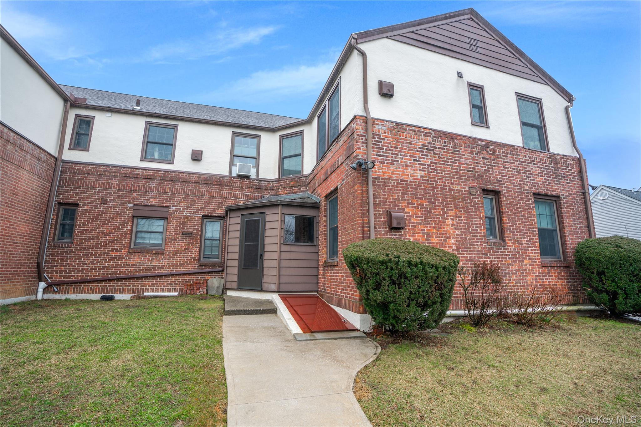 320 Simpson Place Peekskill, NY 10566 - Photo 17 of 18 a front view of a house with a garden