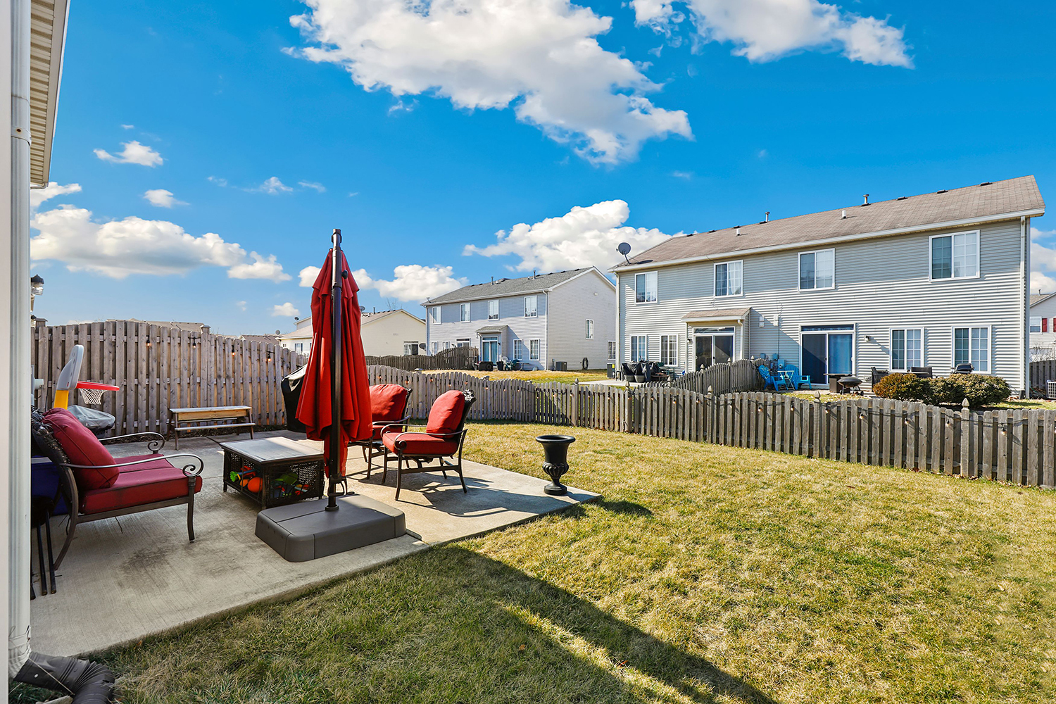 1441 Red Top Lane Minooka, IL 60447 - Photo 17 of 24 a view of a patio with a table chairs and a patio