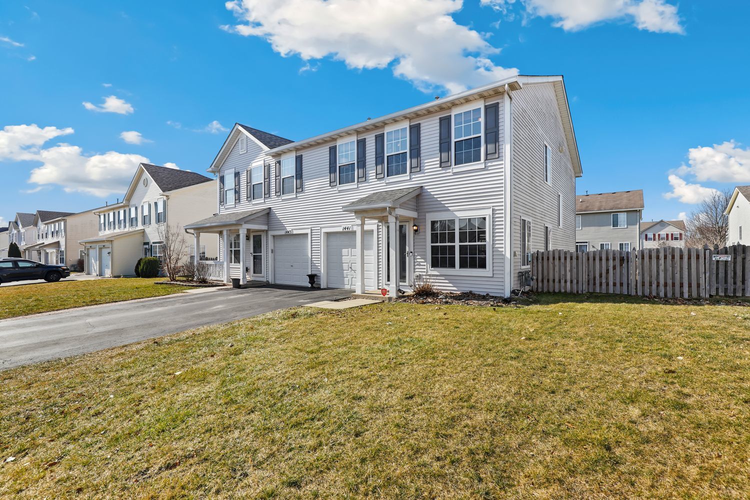 1441 Red Top Lane Minooka, IL 60447 - Photo 2 of 24 a front view of a house with a yard
