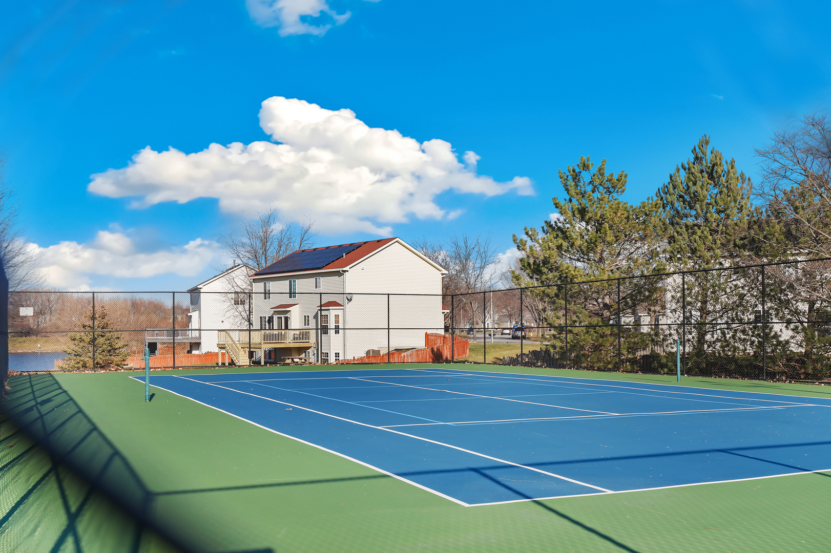 1441 Red Top Lane Minooka, IL 60447 - Photo 22 of 24 a view of yard with swimming pool and trees in the background