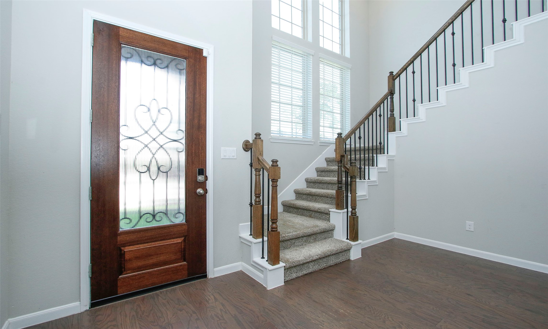 14120 Sand Ridge Court Conroe, TX 77384 - Photo 5 of 43 a view of entryway with wooden floor and stairs