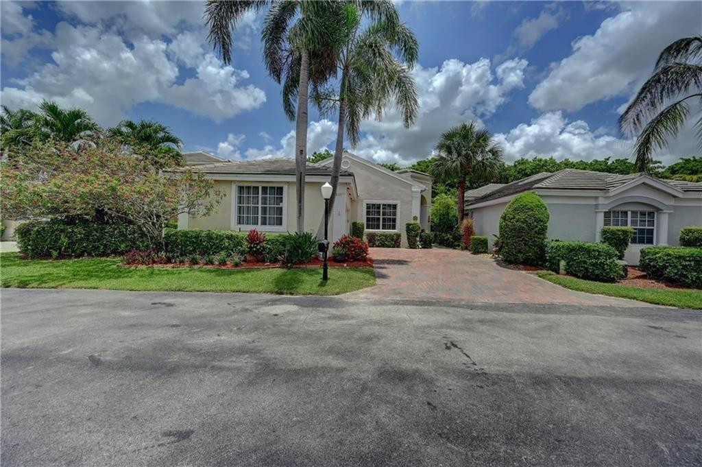 8171 Hampton Wood Drive Boca Raton, FL 33433 - Photo 50 of 56 a front view of house with yard and green space
