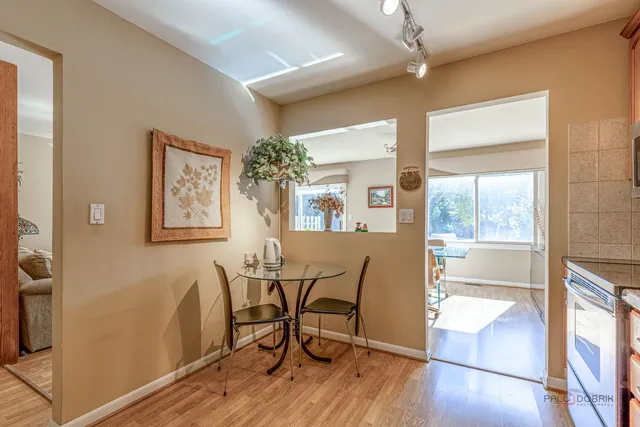 a view of a dining room with furniture and a window