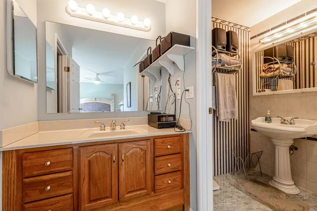 a bathroom with a sink a mirror and a toilet