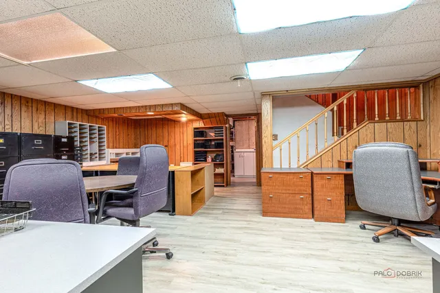 a view of a workspace with furniture and a workspace