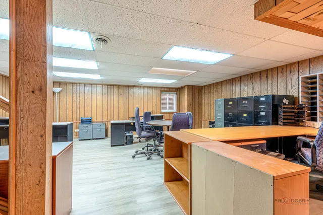 a room with furniture a window and wooden floor