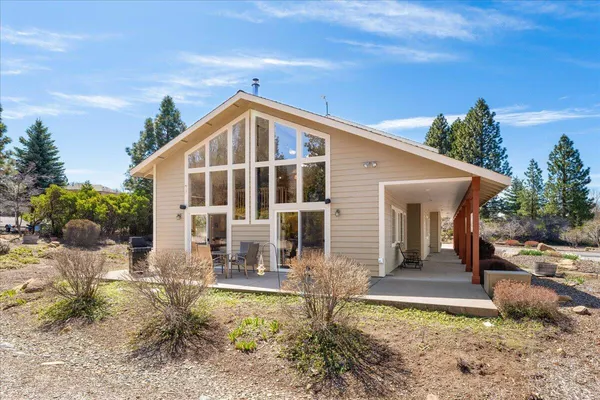 a view of a yard with wooden fence