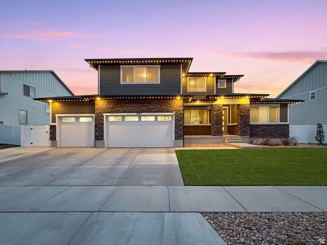 3372 Pinyon Pk Lane Mapleton, UT 84664 - Photo 1 of 1 View of front of house featuring concrete driveway, stone siding, a gate, and a garage