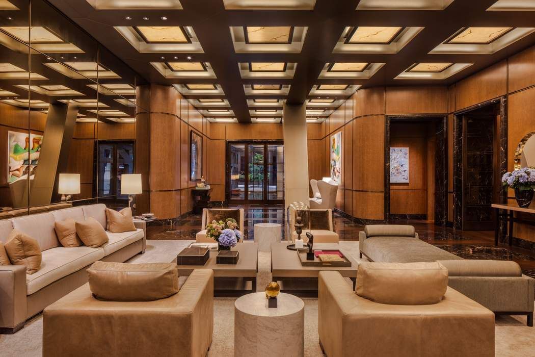 53 West 53rd Street, Unit 36BC Manhattan, NY 10019 - Photo 18 of 25 a living room with furniture and a large window