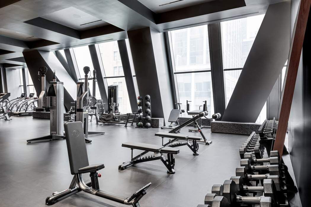 53 West 53rd Street, Unit 36BC Manhattan, NY 10019 - Photo 20 of 25 a view of a room with gym equipment