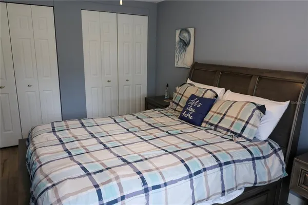 a bedroom with a bed and window