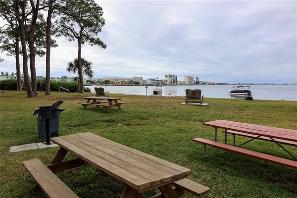 a view of a lake with houses in the background