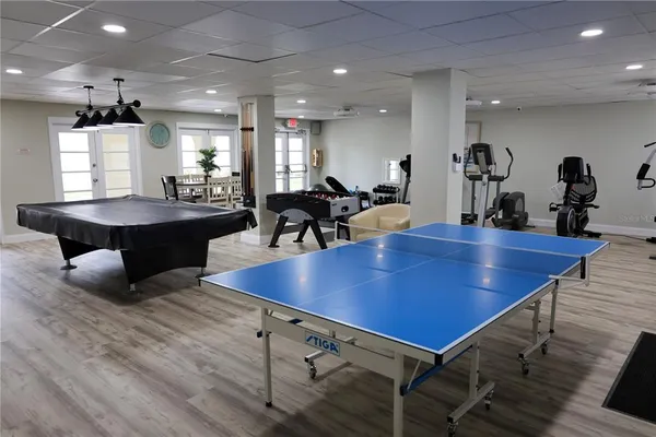 a swimming pool with outdoor seating and yard