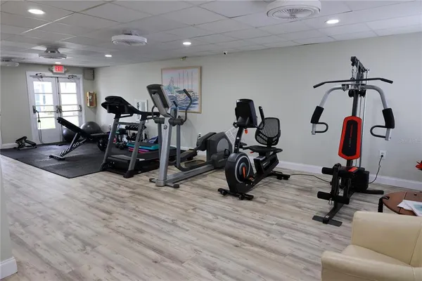 a view of washer and dryer with bathroom in the background