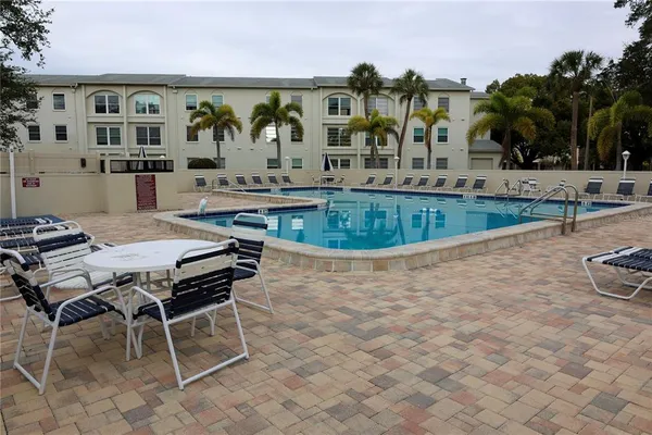 a view of an ocean with a building in the background