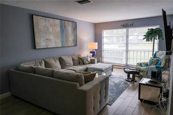 a living room with furniture and a large window