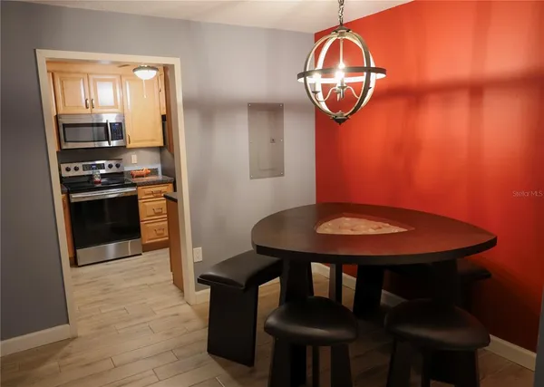 a view of a dining room with furniture and wooden floor