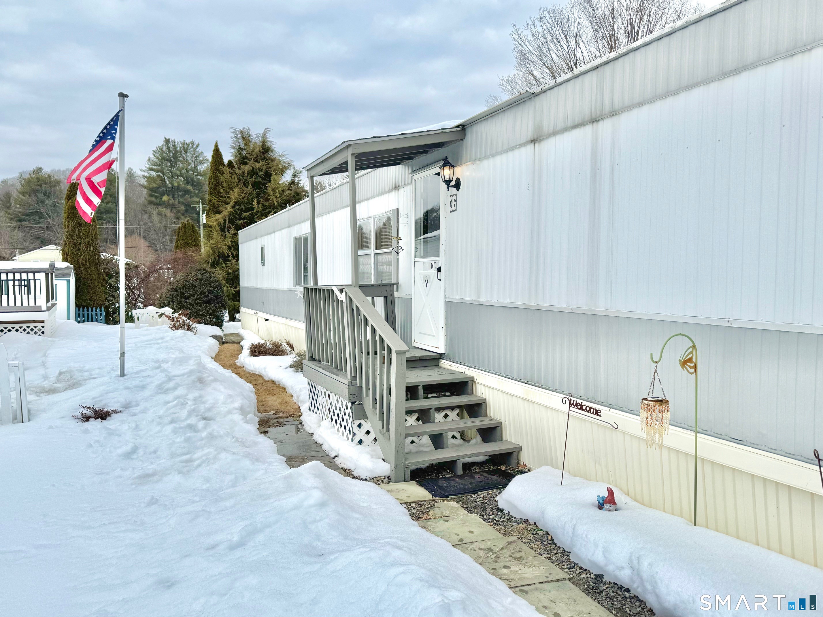 1070 Amity Road Bethany, CT 06524 - Photo 11 of 14 a bedroom with furniture and a wooden floor