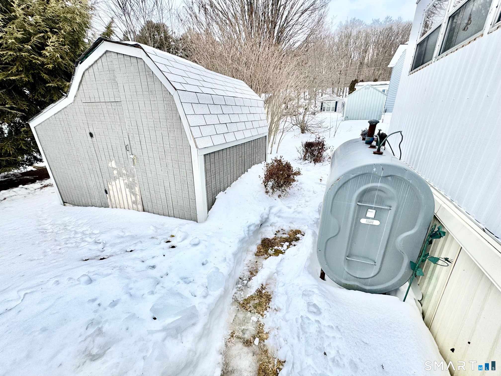 1070 Amity Road Bethany, CT 06524 - Photo 14 of 14 a view of a house with a snow in the yard
