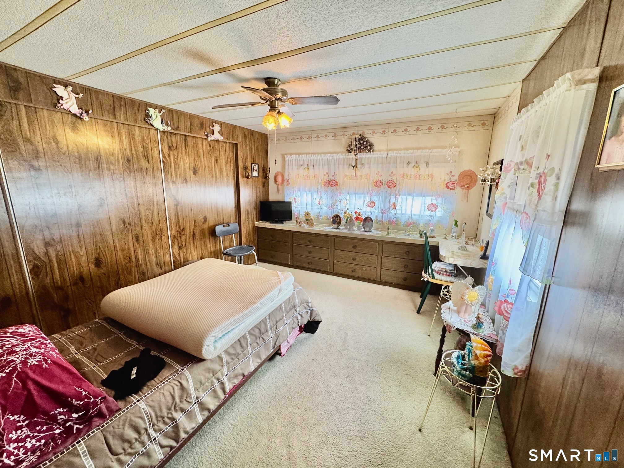 1070 Amity Road Bethany, CT 06524 - Photo 9 of 14 a bedroom with a bed and a chandelier