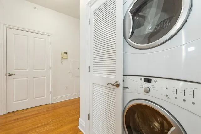 a view of a storage and utility room with washer and dryer
