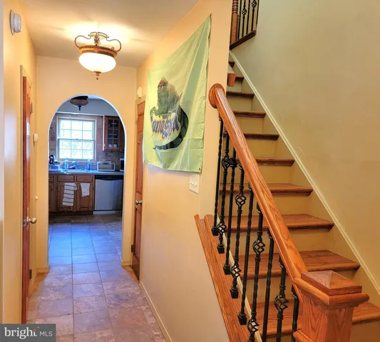 a view of an entryway with wooden floor
