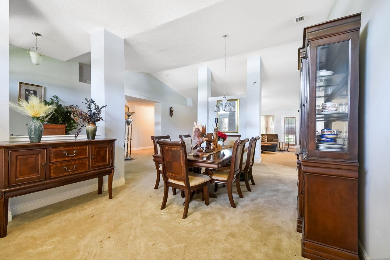 46 Riddle Drive Palm Coast, FL 32164 - Photo 16 of 20 a view of a dining room with furniture