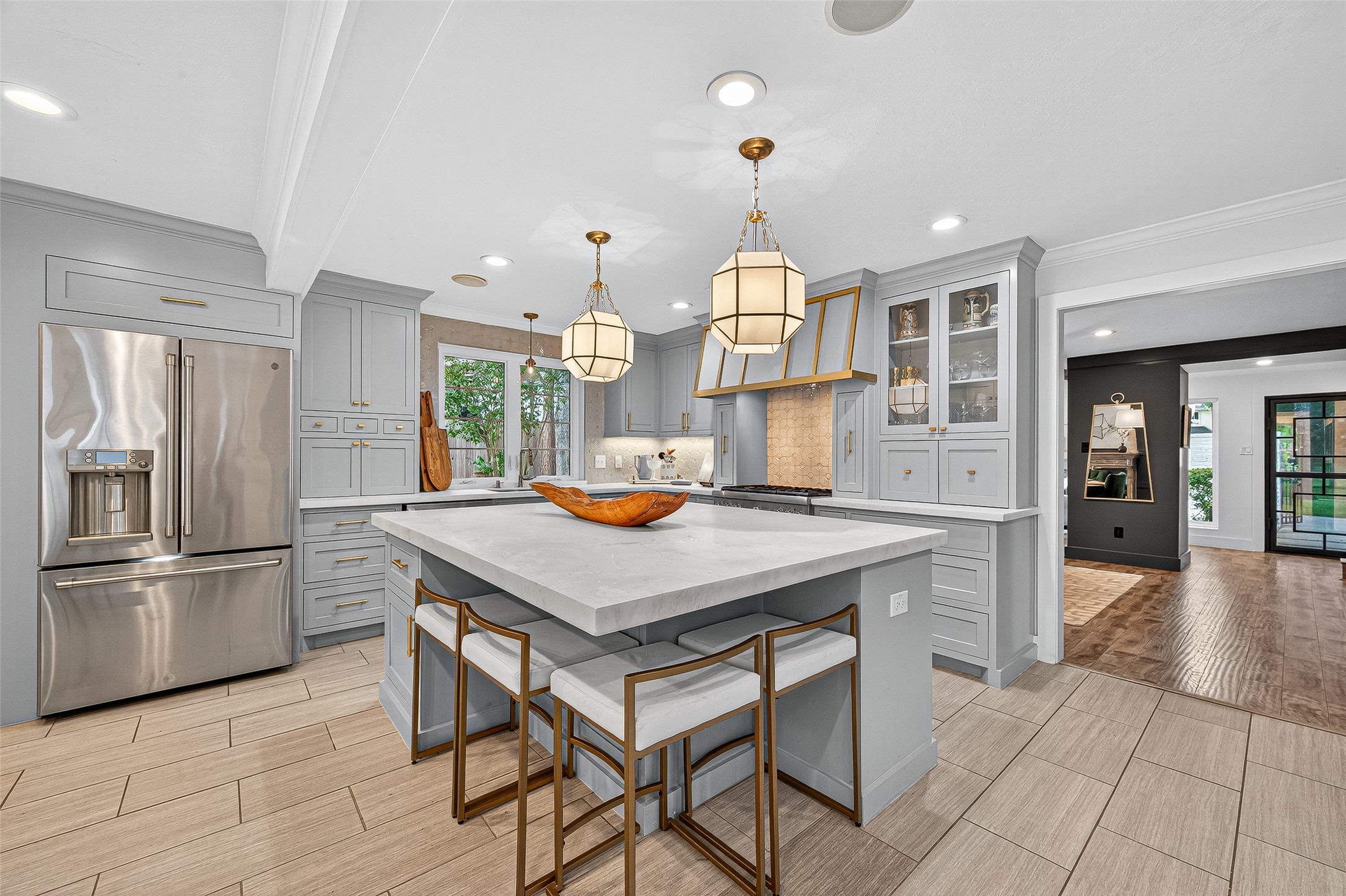415 Ramblewood Road Houston, TX 77079 - Photo 9 of 49 Kitchen fridge will stay with the home. Lots of seating at the island also!