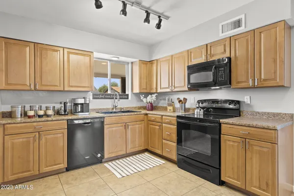 a room with pool table and windows