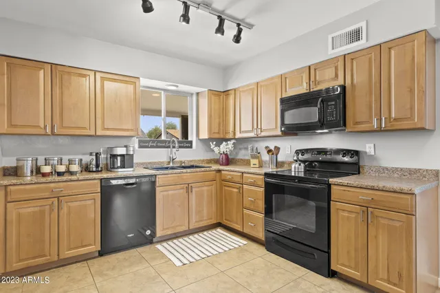 a room with pool table and windows