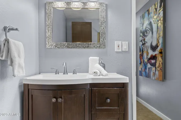 a bathroom with a sink and a mirror