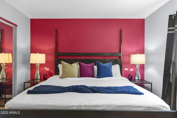 a bedroom with two beds and a window