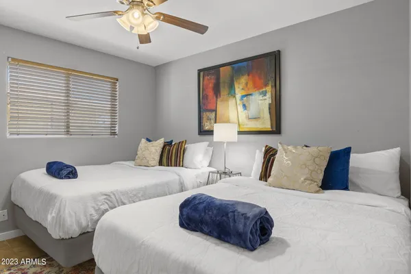 a bedroom with a bed and a table in it