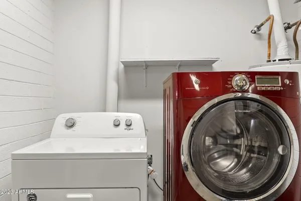 a view of a hallway with two windows