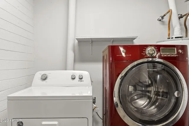 a view of a hallway with two windows
