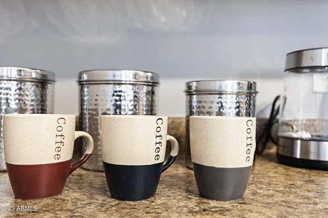 a room with pool table and windows