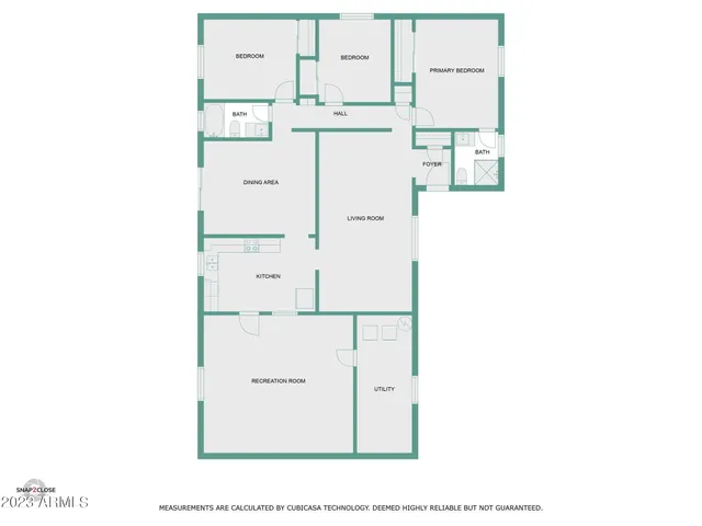 a view of a patio with table and chairs under an umbrella