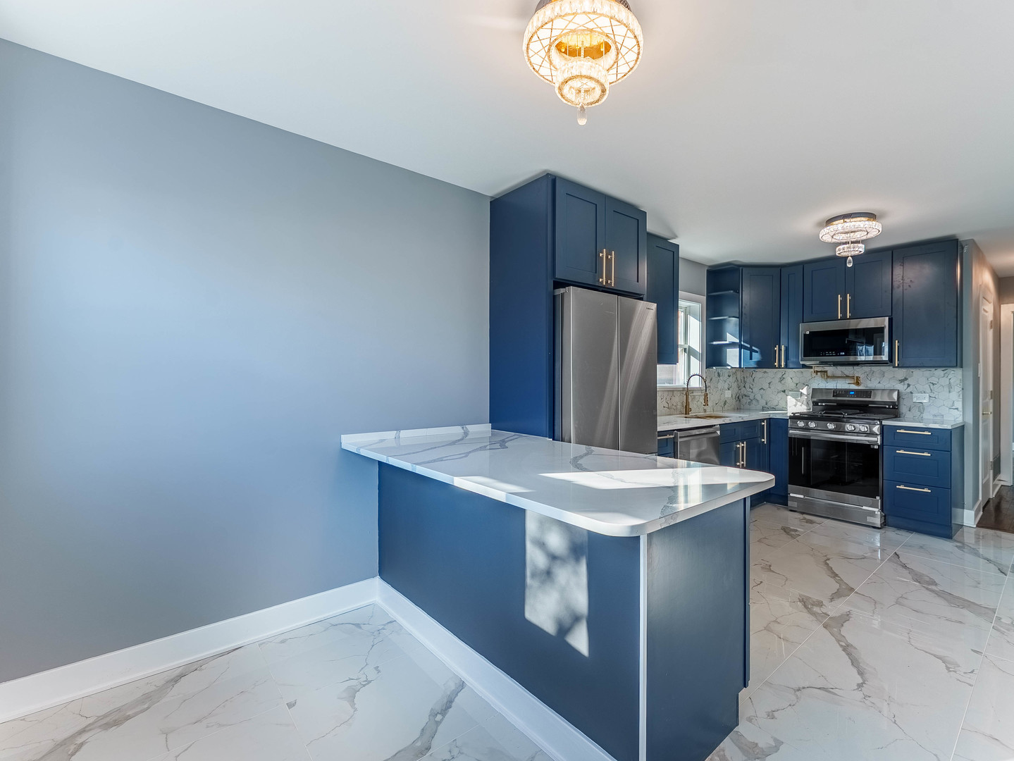 3053 West 77th Street Chicago, IL 60652 - Photo 14 of 24 a kitchen with a sink a stove a refrigerator and a microwave