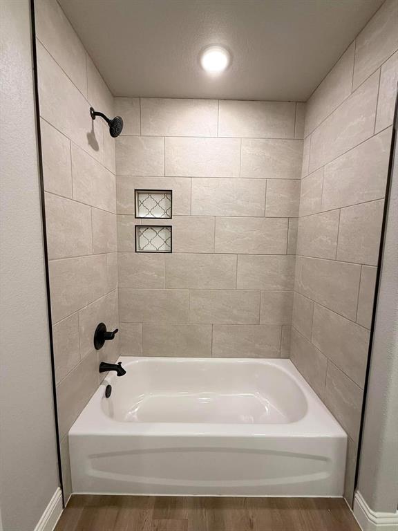 1015 Bluestem Weatherford, TX 76087 - Photo 11 of 11 a bathroom with a bathtub