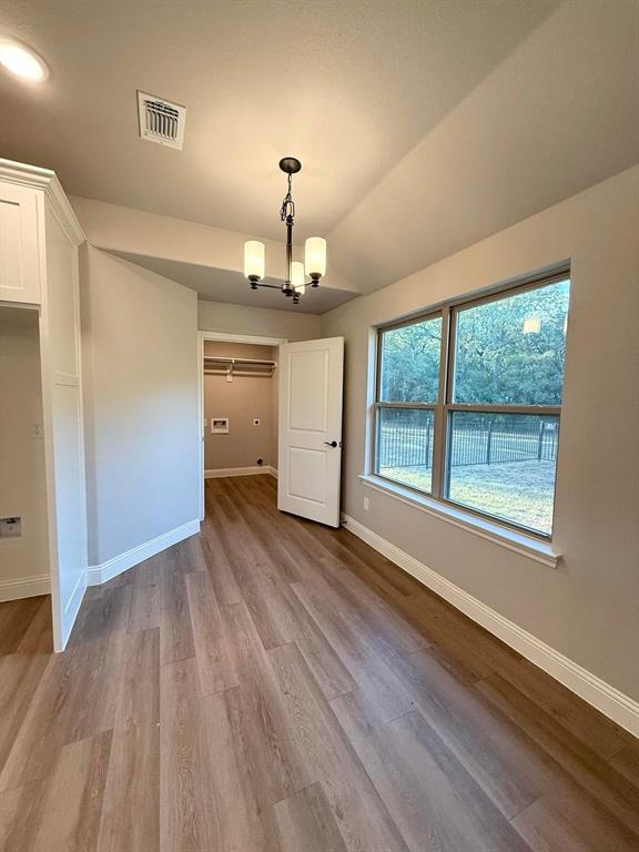 1015 Bluestem Weatherford, TX 76087 - Photo 9 of 11 a view of a livingroom with wooden floor and a window