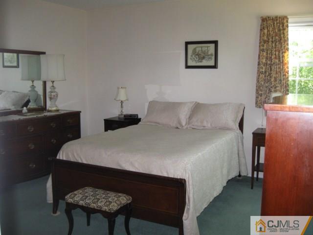 10 Glen Gary Road Middlesex, NJ 08846 - Photo 12 of 24 a bedroom with a bed and a table