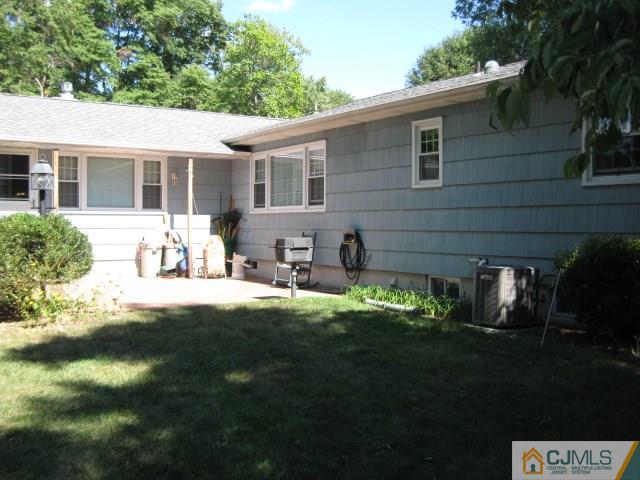 10 Glen Gary Road Middlesex, NJ 08846 - Photo 20 of 24 a front view of a house with a yard