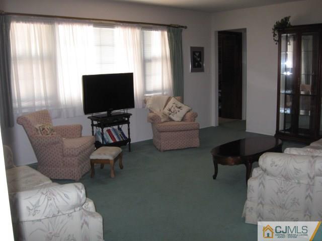 10 Glen Gary Road Middlesex, NJ 08846 - Photo 3 of 24 a living room with furniture and a flat screen tv